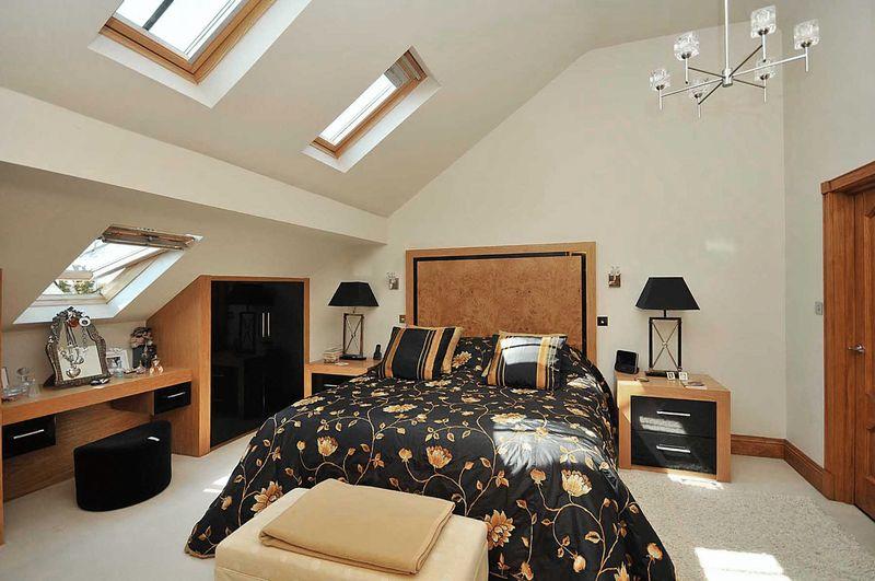 Click to see a larger image photo of beige bedroom loft conversion with velux windows