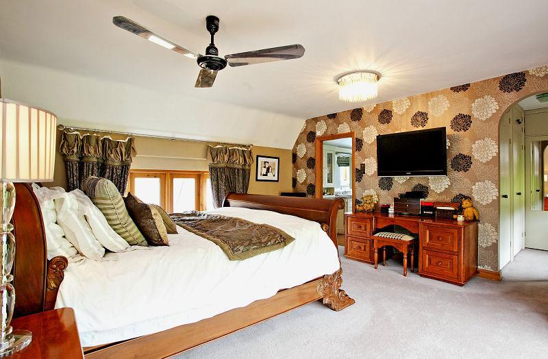 photo of beige white bedroom master bedroom with ceiling fan feature ...