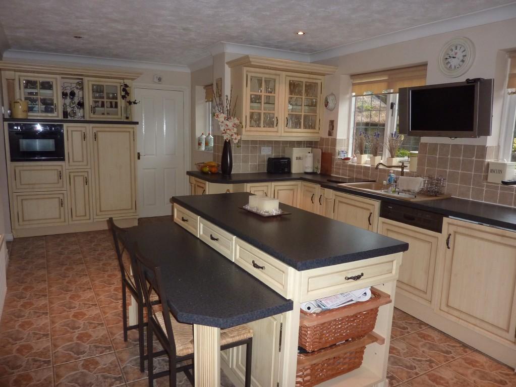 fitted kitchen with breakfast bar