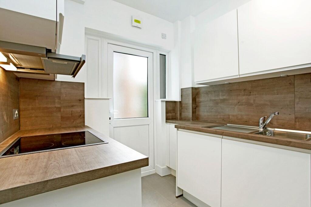 Main image of property: 10 Brondesbury Court 235 Willesden Lane