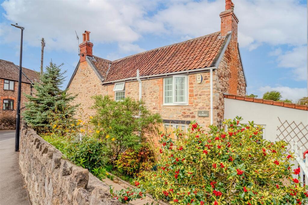 Main image of property: Delightful character cottage in the heart of the popular village of Easton-in-Gordano