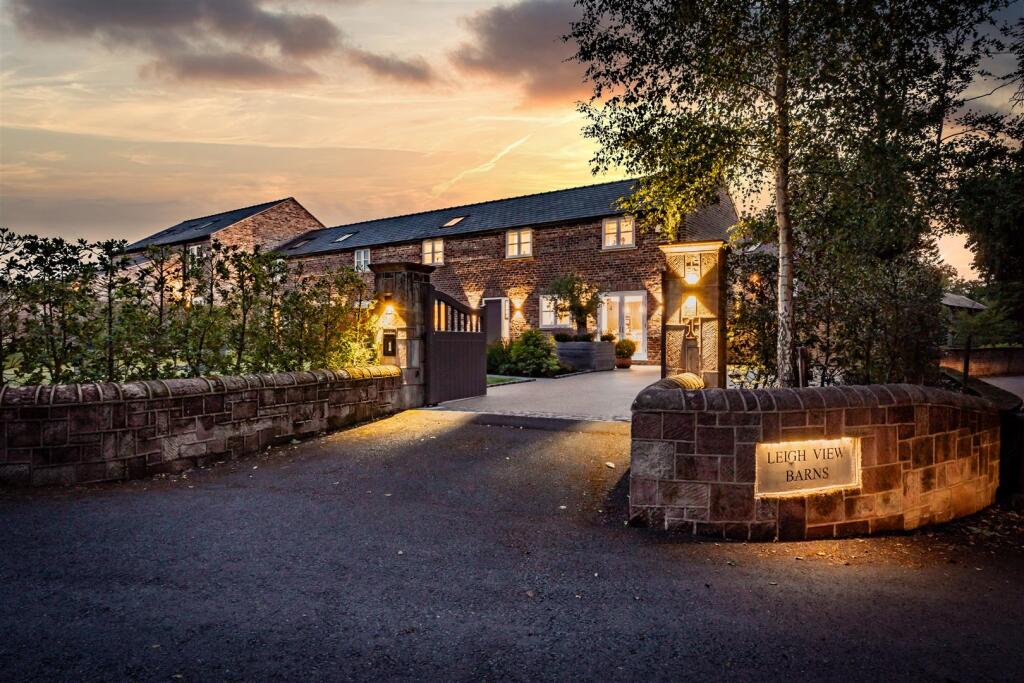 Main image of property: Bespoke four bedroom barn conversion with private landscaped garden and garage