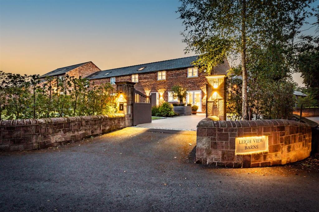 Main image of property: Bespoke four bedroom barn conversion with private landscaped garden and garage