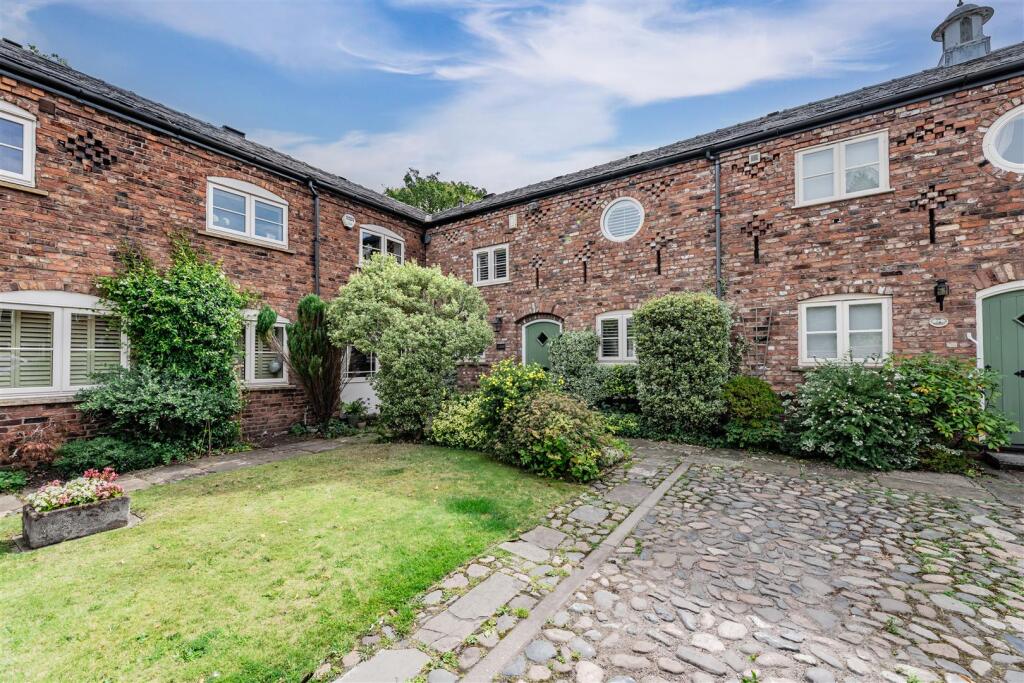 Main image of property: Idyllic mews property within a private courtyard with south-facing gardens