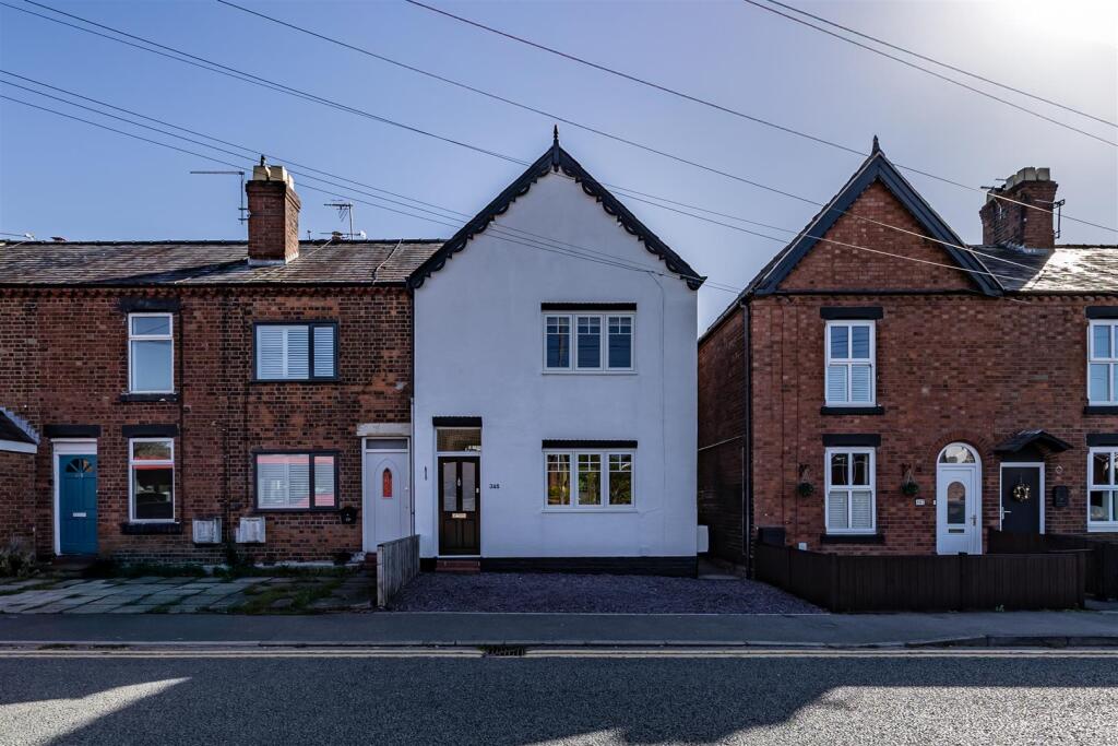 Main image of property: Perfectly presented end terraced property with period charm and generous rear garden