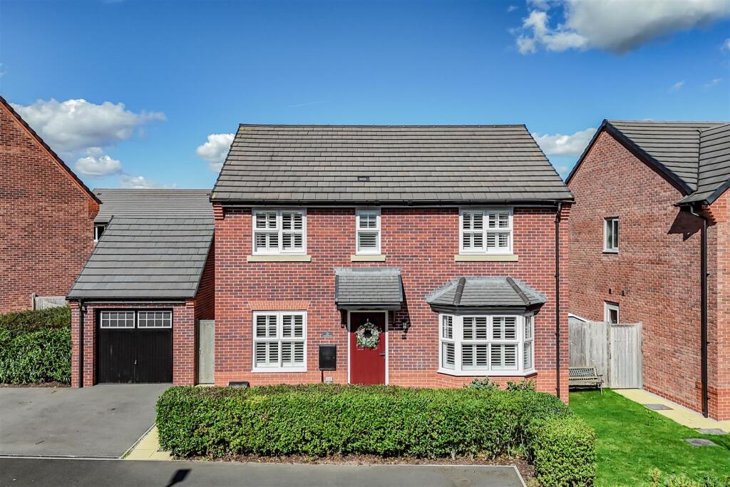 Main image of property: Detached four-bedroom family home tucked away on the prestigious Kingsbourne development