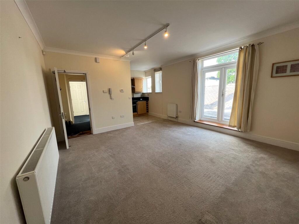 Main image of property: A Queens Road, Weybridge, Surrey, KT13