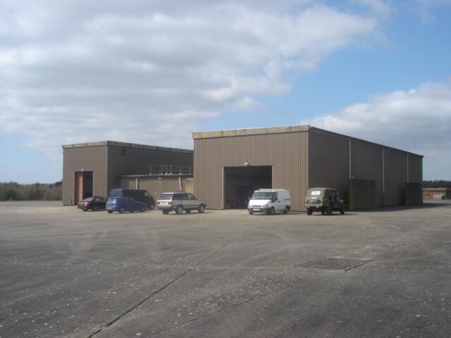 Main image of property: Warehouse & Up To 5 acres To Let Former Gama Site, Brackenwood Lane Greenham Common, Newbury, Berkshire, RG14 7HQ