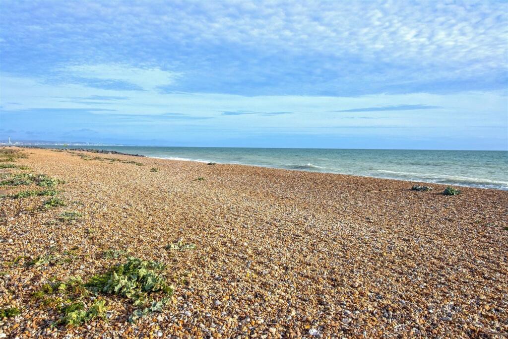 Main image of property: Beach Green Beachuts