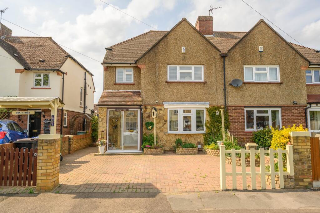 Main image of property: Longmore Road, Hersham, KT12