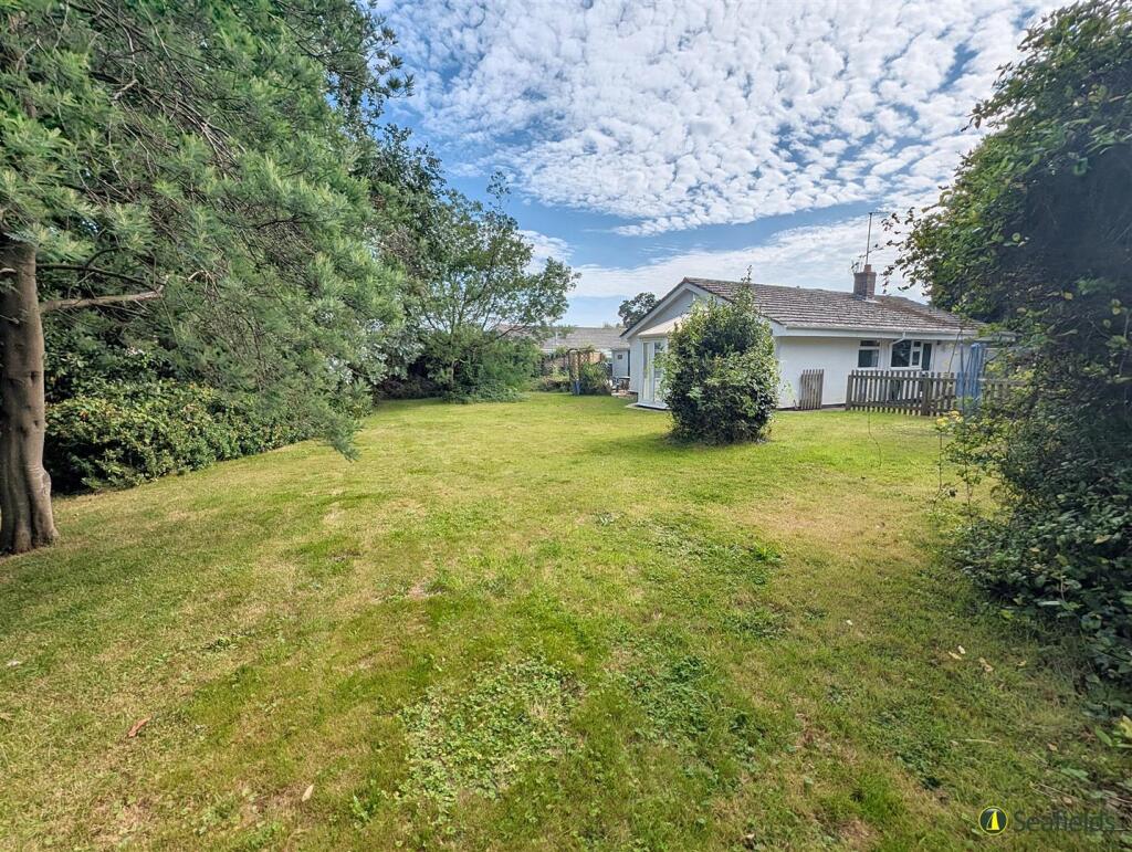 Main image of property: Woodland Grove, Bembridge, PO35 5SG