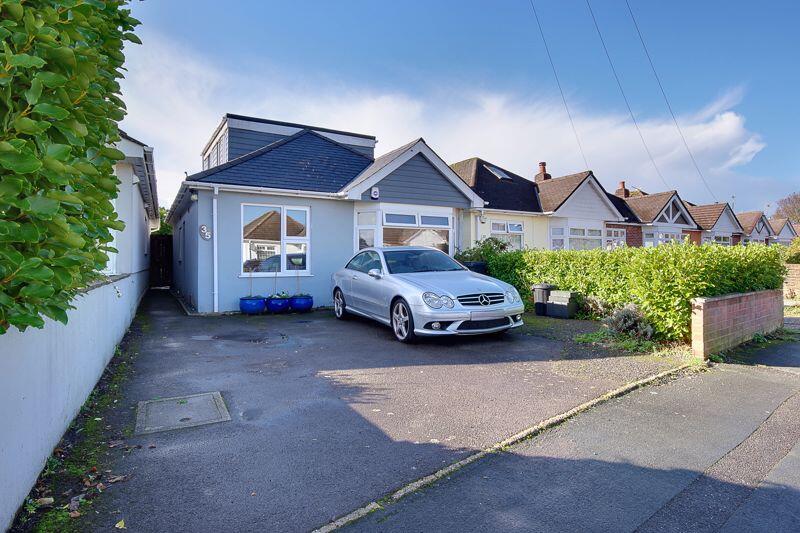 Main image of property: Bascott Road, Wallisdown -Charming and Spacious: Four-Bedroom Chalet Hideaway