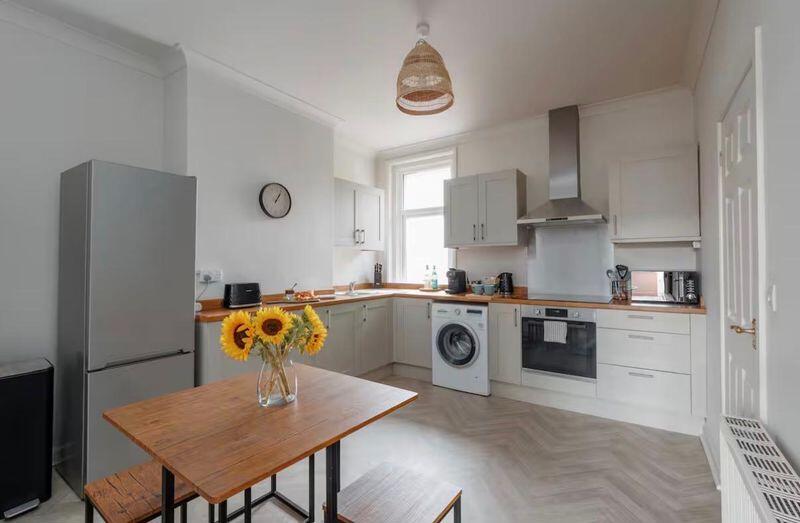 Main image of property: Newly Refurbished 2-Bedroom Flat - Modern, Spacious, with Parking