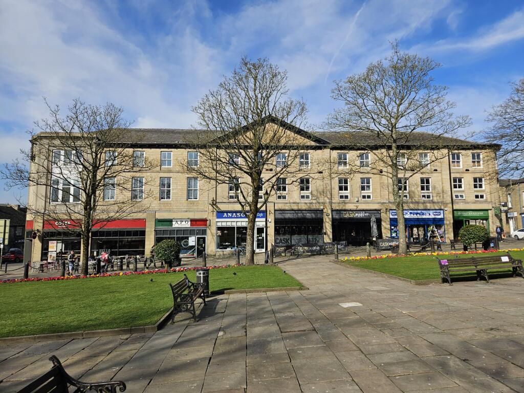 Main image of property: The Old Co-Op Building, Norfolk Square, Glossop, Derbyshire SK13 8BP