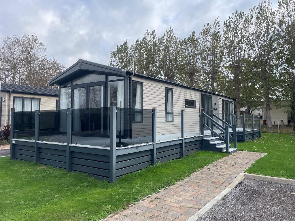 Main image of property: Lakewood Lodge, Warners Lane, PO20 9EL