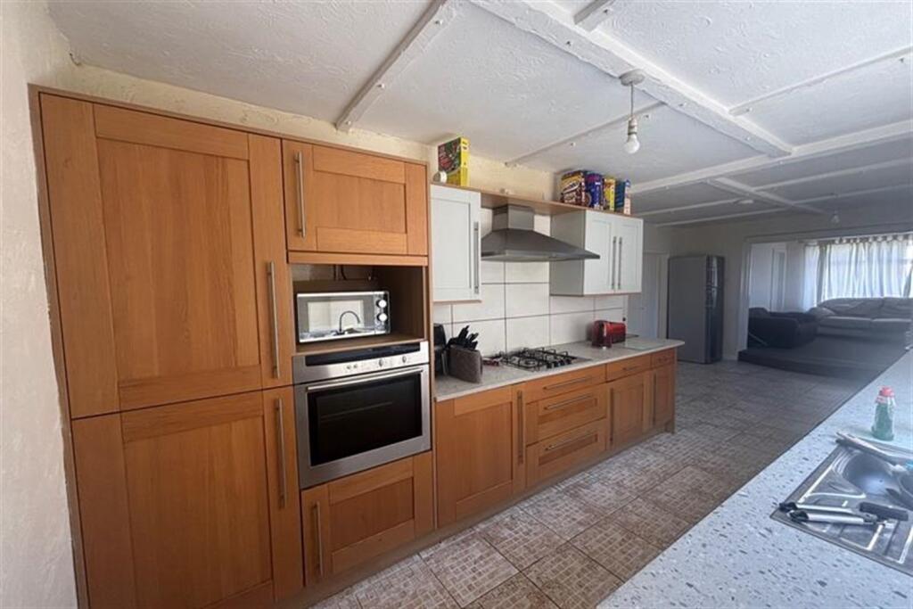 Main image of property: 5 bedroom Detached Chalet Bungalow in Wallisdown