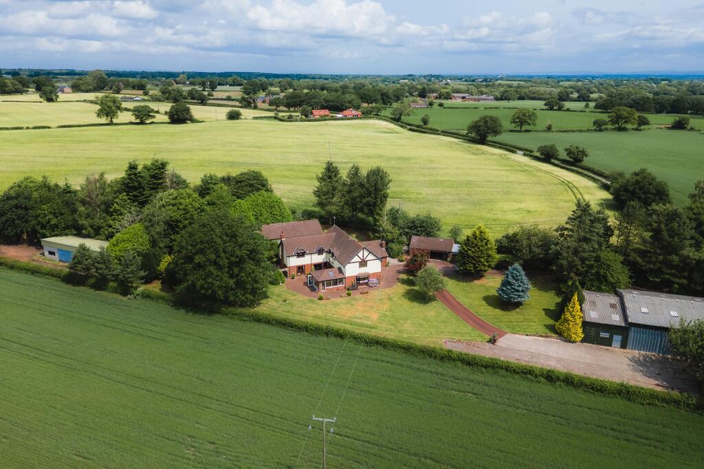 Main image of property: Large family home with substantial outbuildings on the edge of Little Budworth