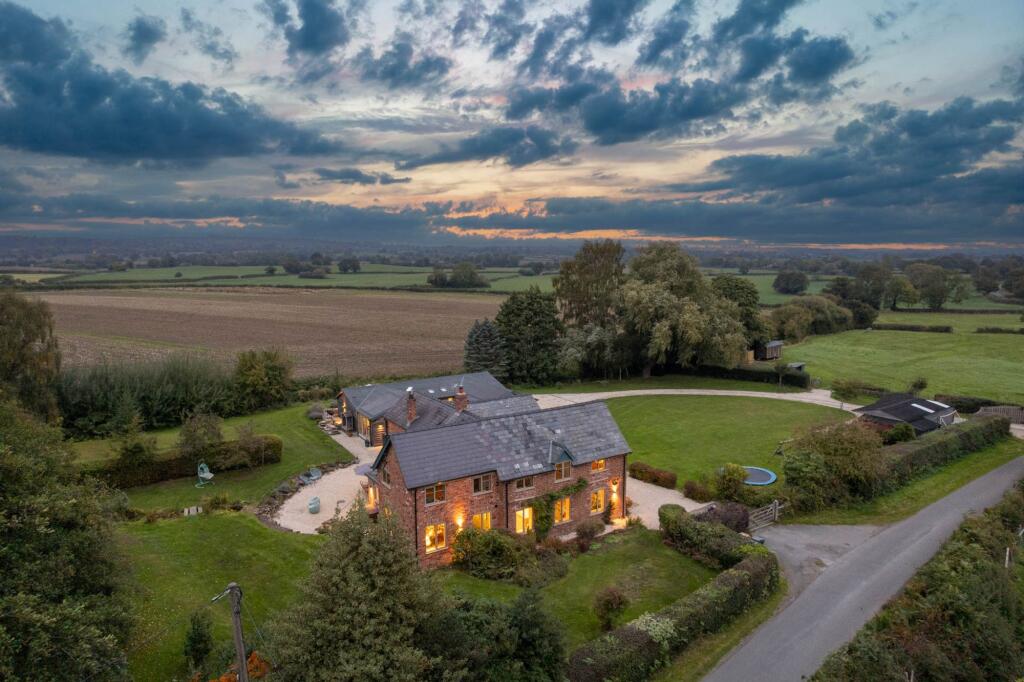 Main image of property: Exceptional Tarporley home with a large detached annexe and land