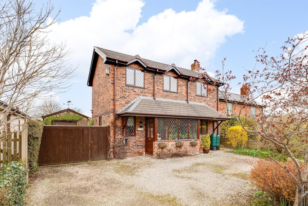 Main image of property: A modern cottage with views and glorious gardens in Huxley Lane