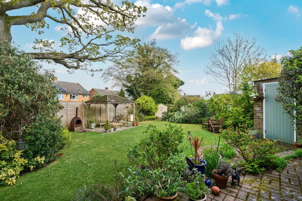 Main image of property: An elegant family home tucked away in a quiet cul-de-sac