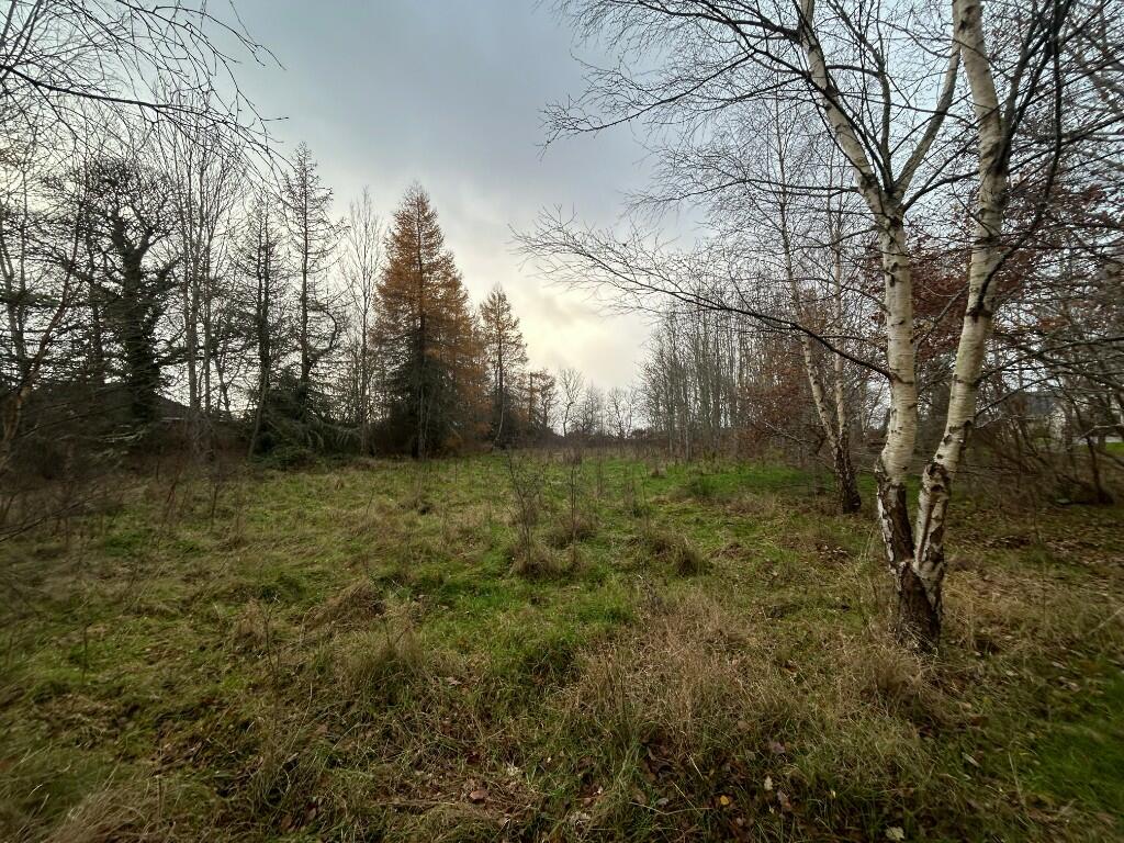 Main image of property: Land NW of 11-12 Mansefield Park, Kirkhill, IV5 7ND