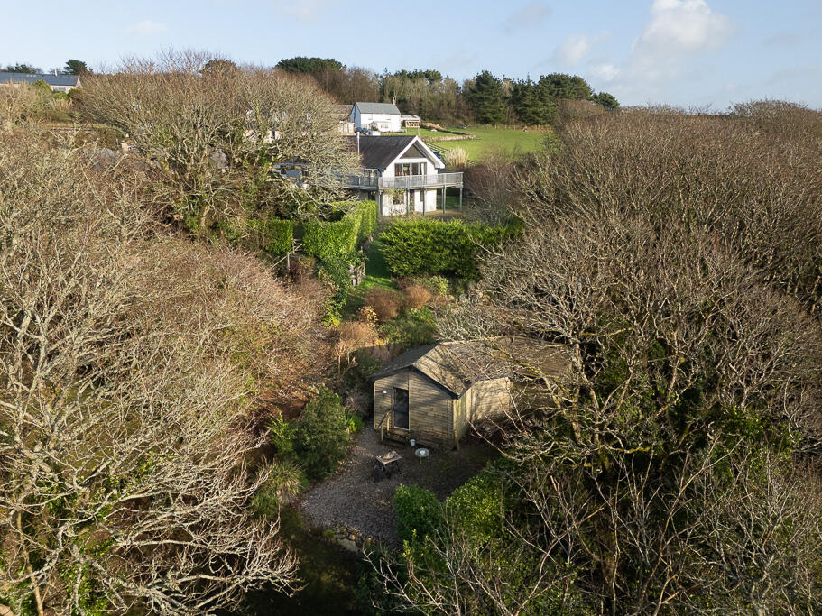 Main image of property: Orchard Lea - Cucurrian - 6 Bedroom Home with stunning private gardens