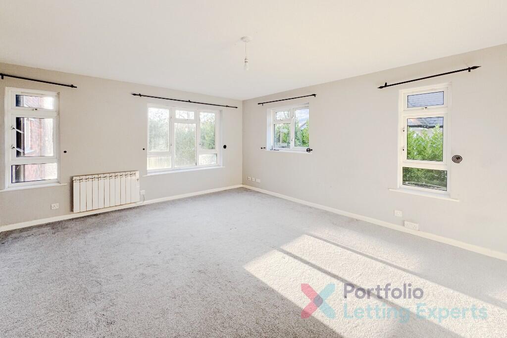 Main image of property: Spacious 2 Bedroom Flat With Underground Parking - Moat Court, Branksome Wood Road!