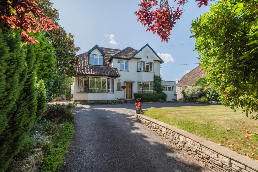Main image of property: A gorgeous 1930s detached five-bedroom home in Backwell with a stunning garden, ample parking and a garage.