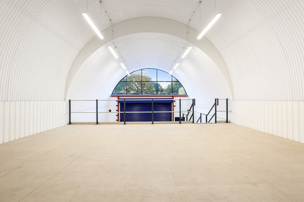 The mezzanine level of an arch with white lining.