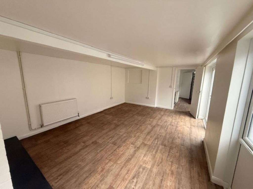 The front of an arch, with glazing on the bottom half and door allowing you to see into the arch interior.