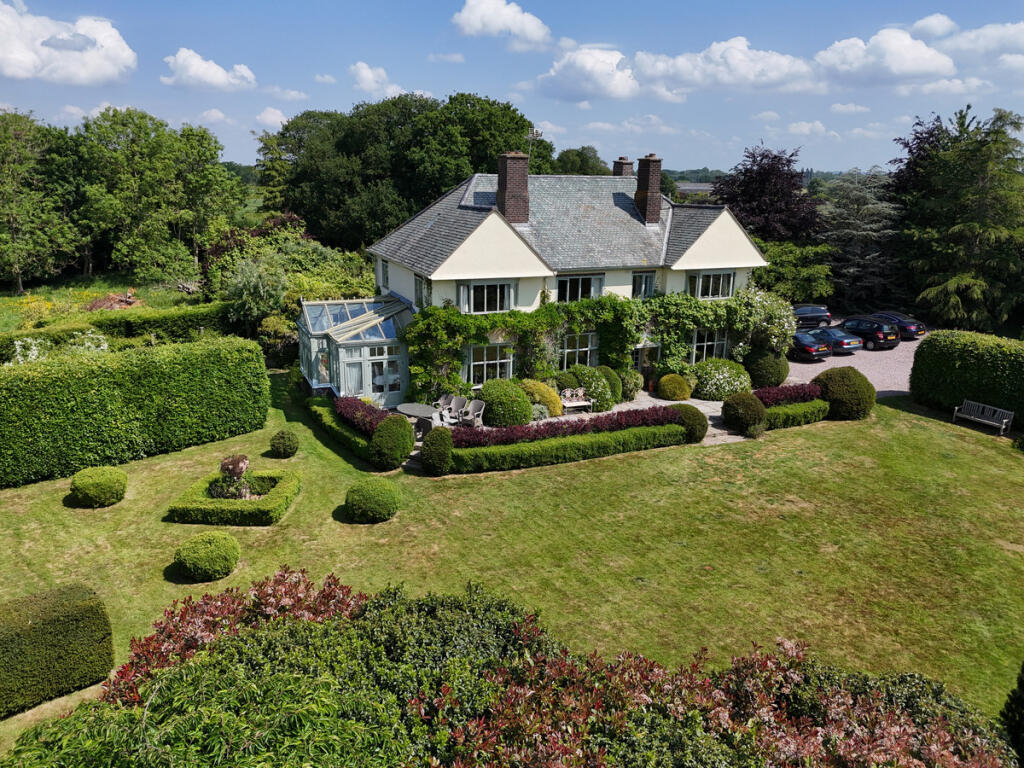 Main image of property: Arts & Crafts five bedroom family home set in 1.5 acres of private and mature grounds