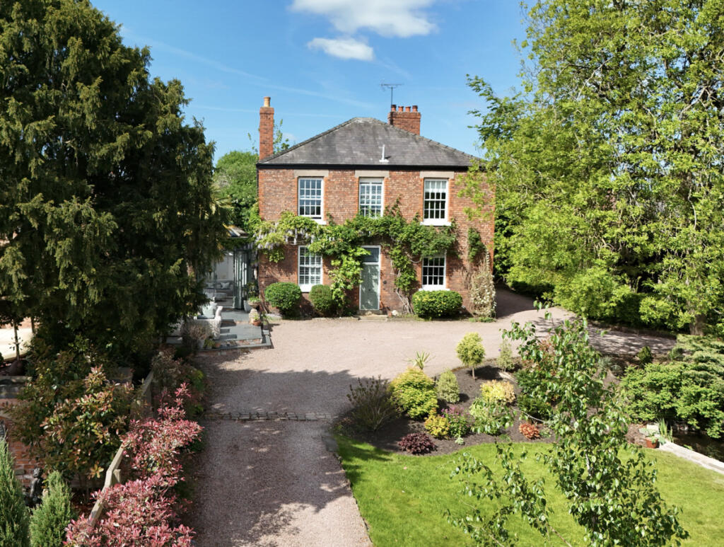 Main image of property: Georgian-style home, rich in period features and set within expansive, private grounds in the heart of Nantwich