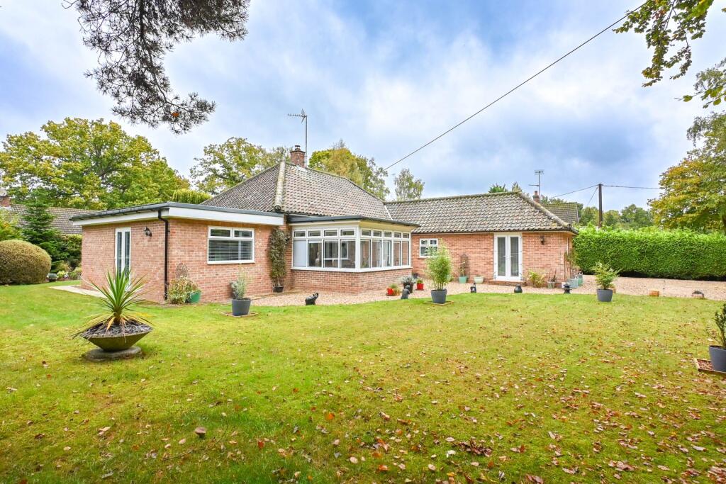 Main image of property: A BEAUTIFULLY REFURBISHED DETACHED BUNGALOW ON A MATURE HALF-ACRE PLOT IN HIGH KELLING