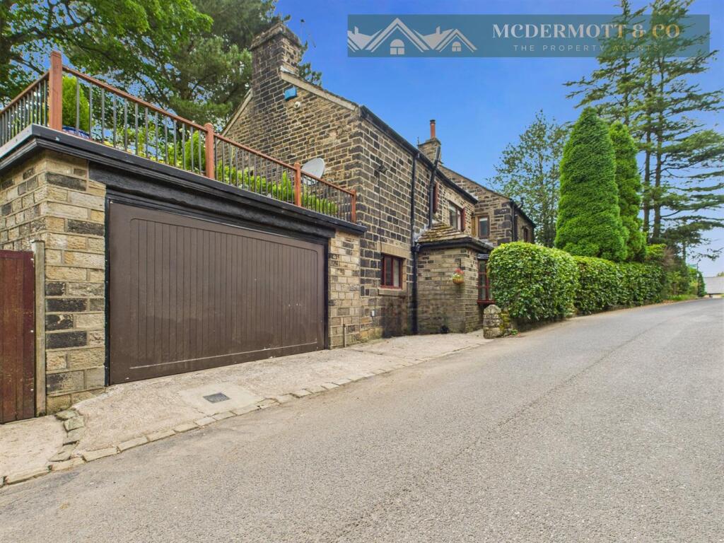 Main image of property: Spring Cottage, Boarshurst, Greenfield