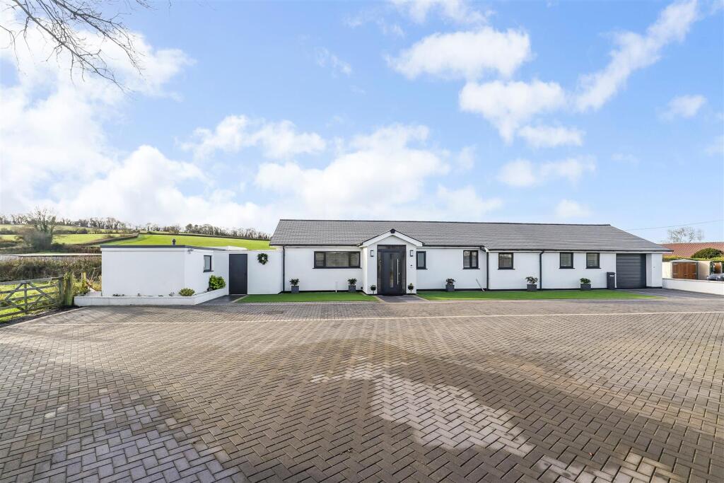 Main image of property: Stunning detached (2,000 sq ft) high spec bungalow in an idyllic rural setting with stunning open views