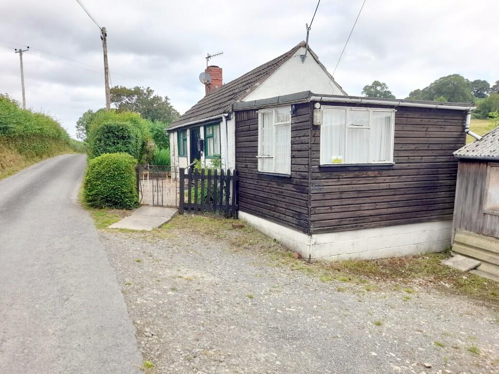 Main image of property: Lane Bungalow, Moel y Garth, Guilsfield, Welshpool, Powys, SY21 9JF
