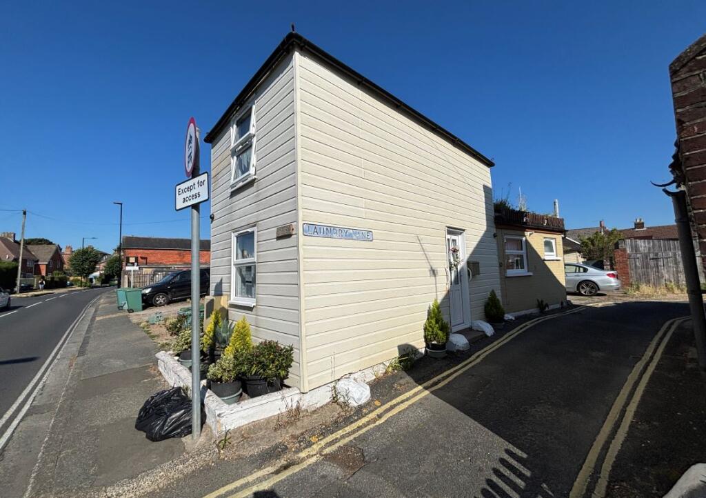 Main image of property: Lavender Cottage, 1 Laundry Lane, Newport, Isle Of Wight, PO30 1QL