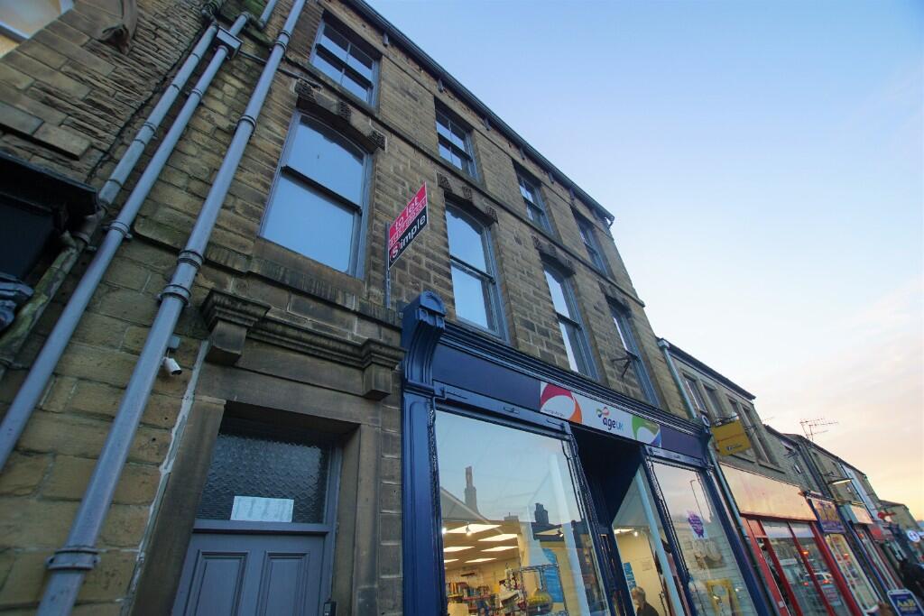Main image of property: Flat at High St West, Glossop, SK13 8AZ **CENTRAL**