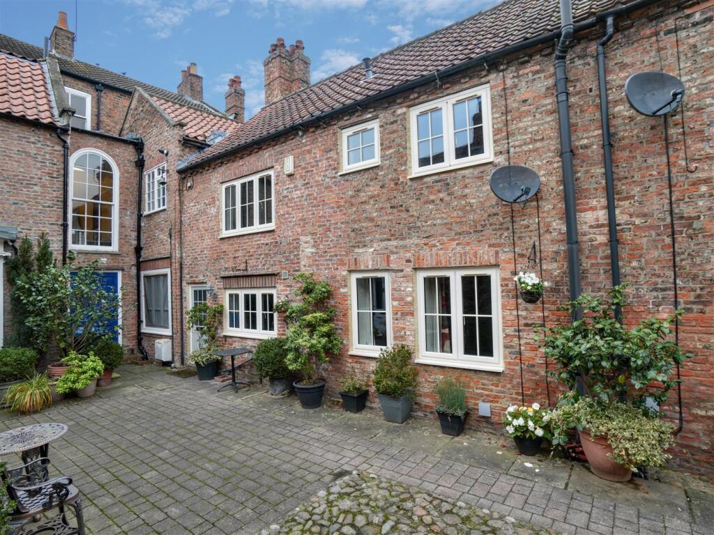 Main image of property: Bannister Court, Back Lane, Easingwold, YO61 3QW