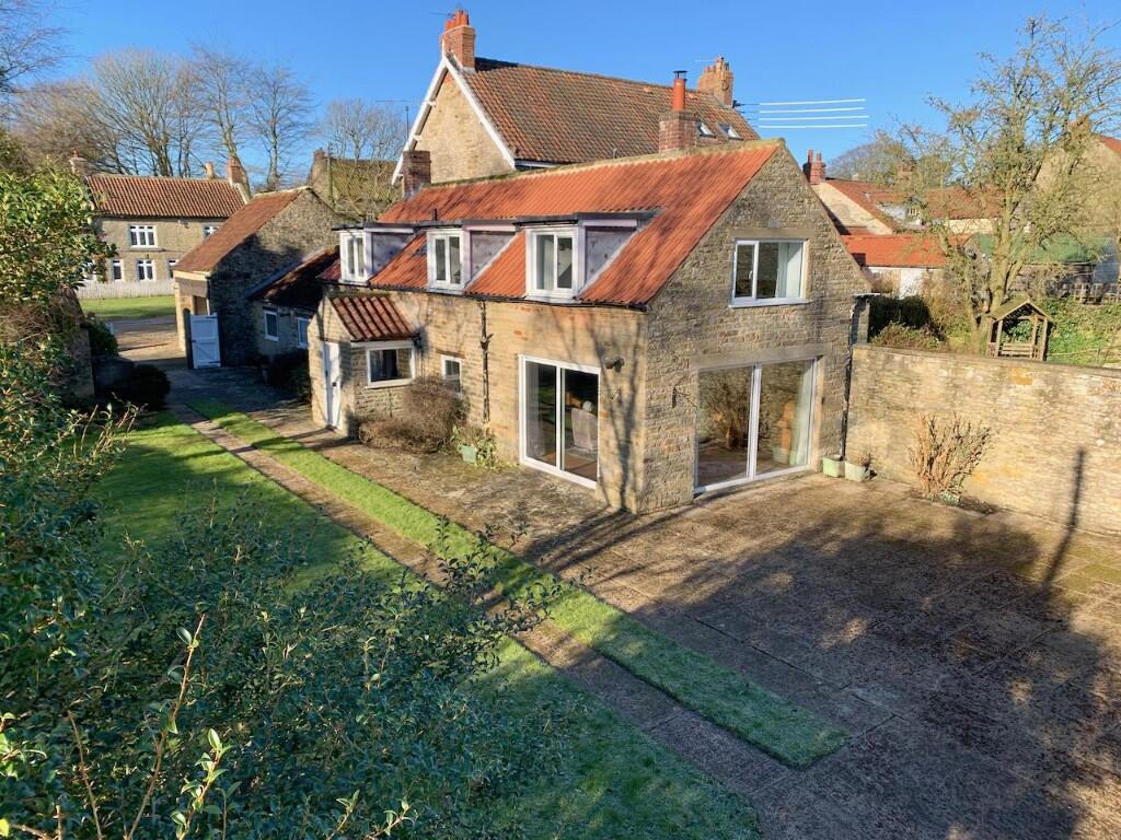 Main image of property: White Heather Cottage, Main Street, Levisham,  YO18 7NL