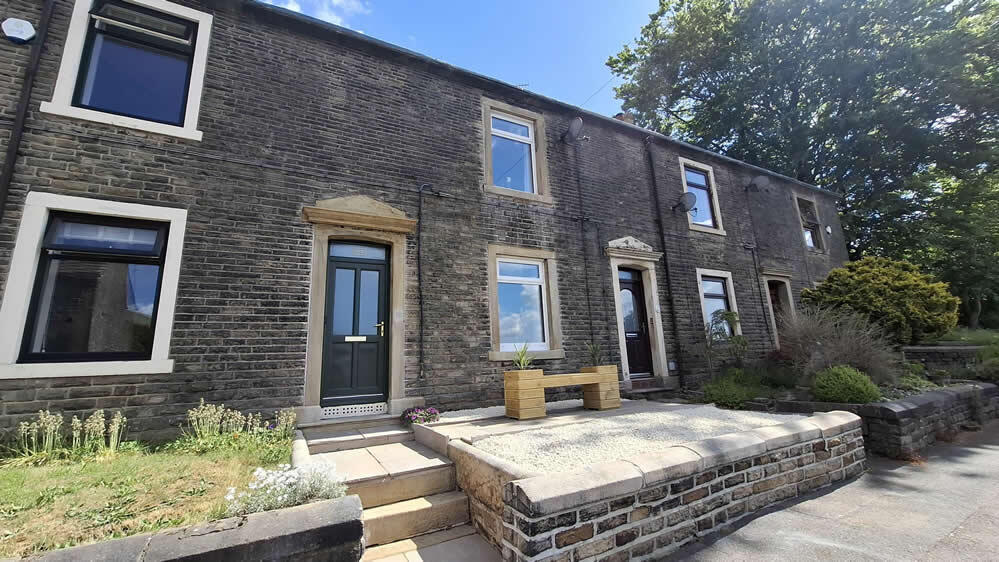 Main image of property: 13 Huddersfield Road, Denshaw, OL3 5SD