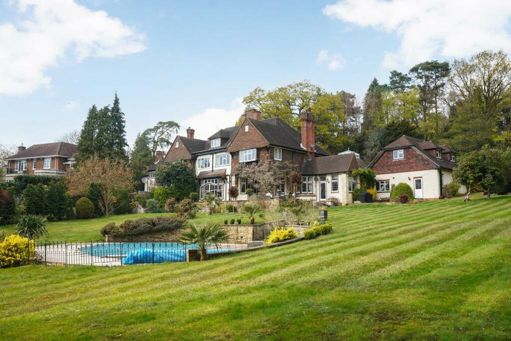 Main image of property: Wood Lane, Weybridge, KT13