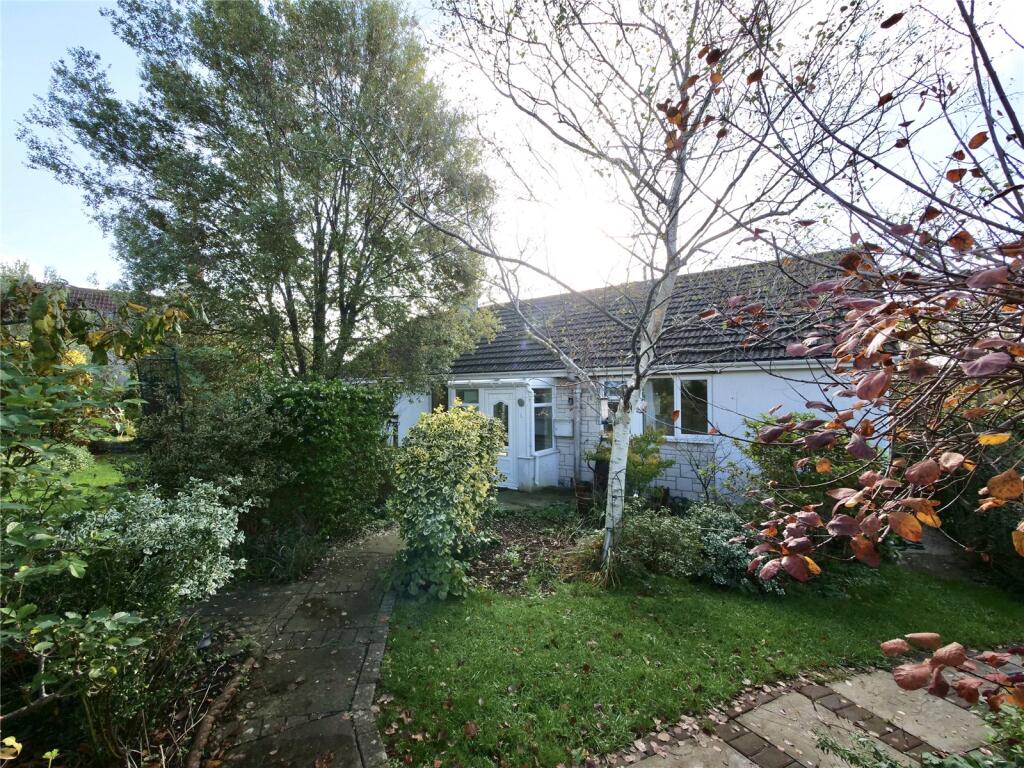Main image of property: Three-Bedroom Detached Bungalow with a Wrap-Around Gardens, Garage & Off-Street Parking