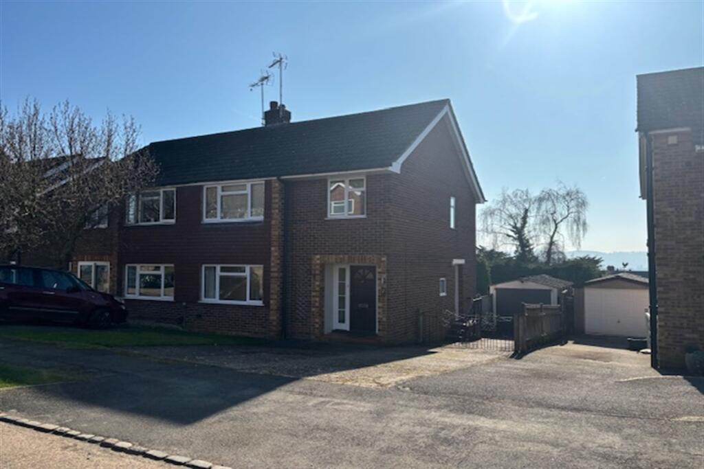 Main image of property: Woodland Close