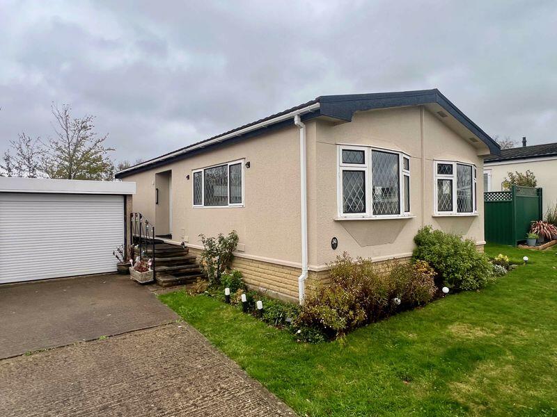 Main image of property: Great value residential park home in need of some up dating with views over open fields.