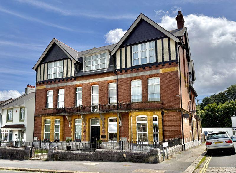 Main image of property: Milehouse Road, Milkehouse, Plymouth. Spacious & Stylish Three-Bedroom Apartment in Period Building – Stoke Village