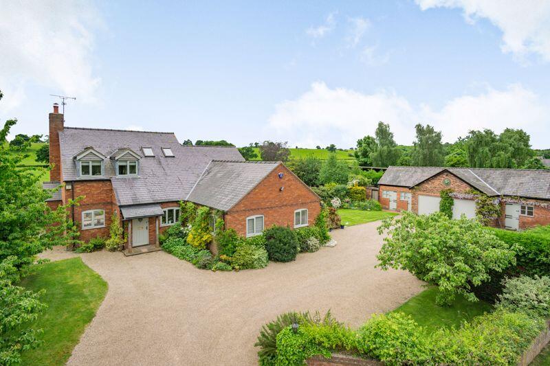 Main image of property: Charming Detached House with Outbuildings.