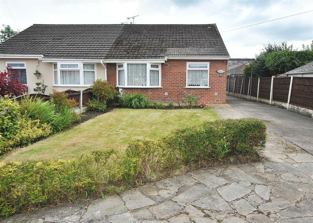 Main image of property: 2 Woodlands Avenue, Irlam M44 6NH