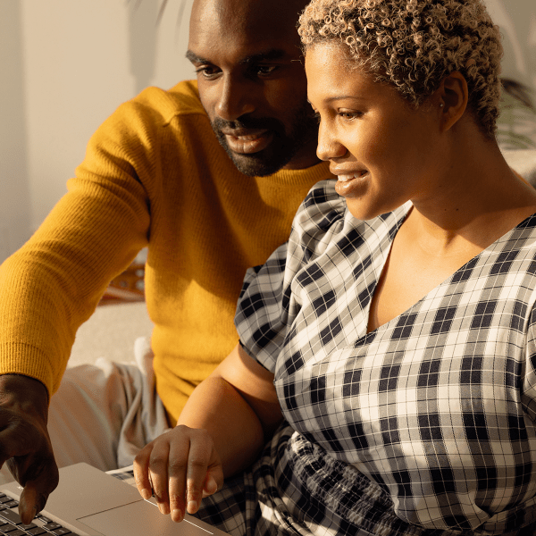 Image of a couple looking at a computer screen