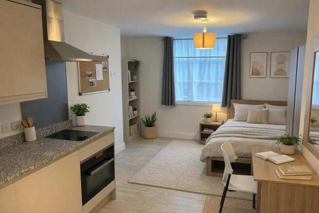 bed area and kitchen dressed.jpg